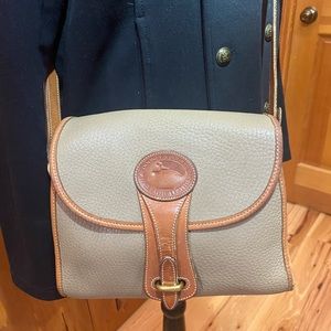 Vintage Dooney and Bourke crossbody bag. Soft tan pebbled leather.